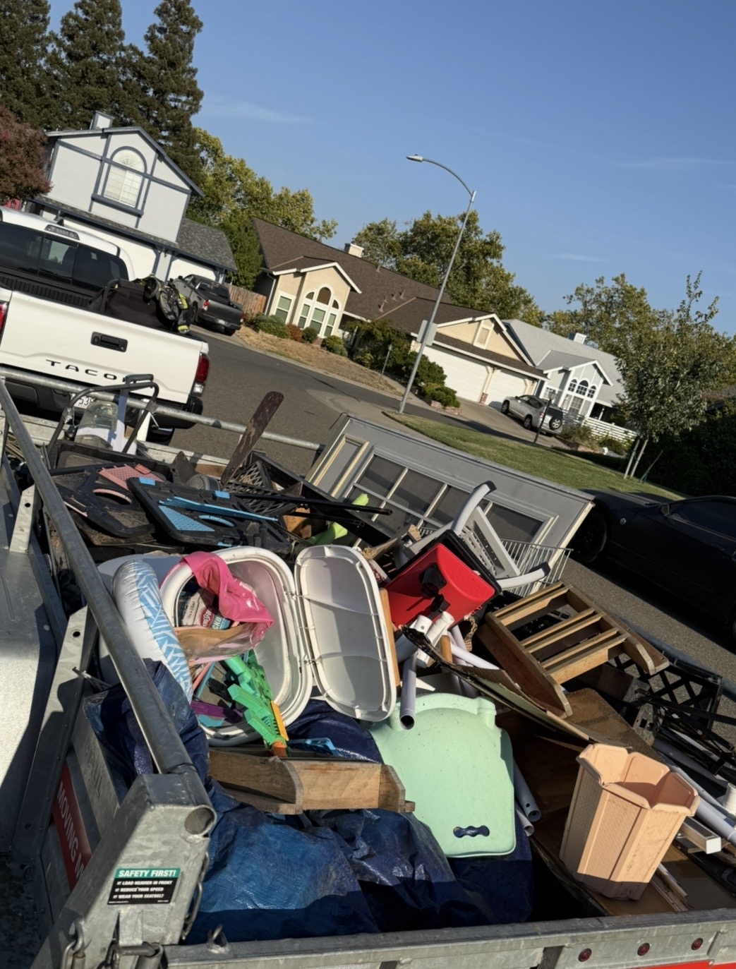 Trailer loaded with household junk on a Sacramento street